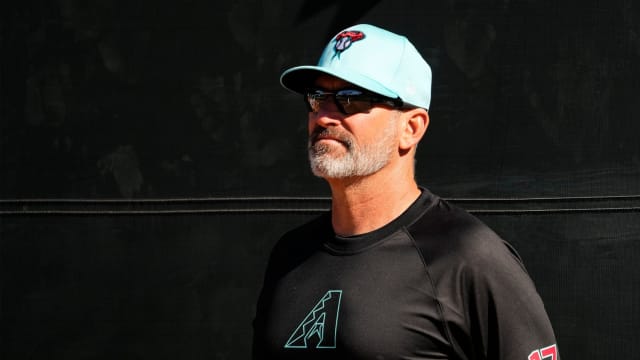 Arizona Diamondbacks manager Torey Lovullo (17) watches his team work out at Salt River Fields.